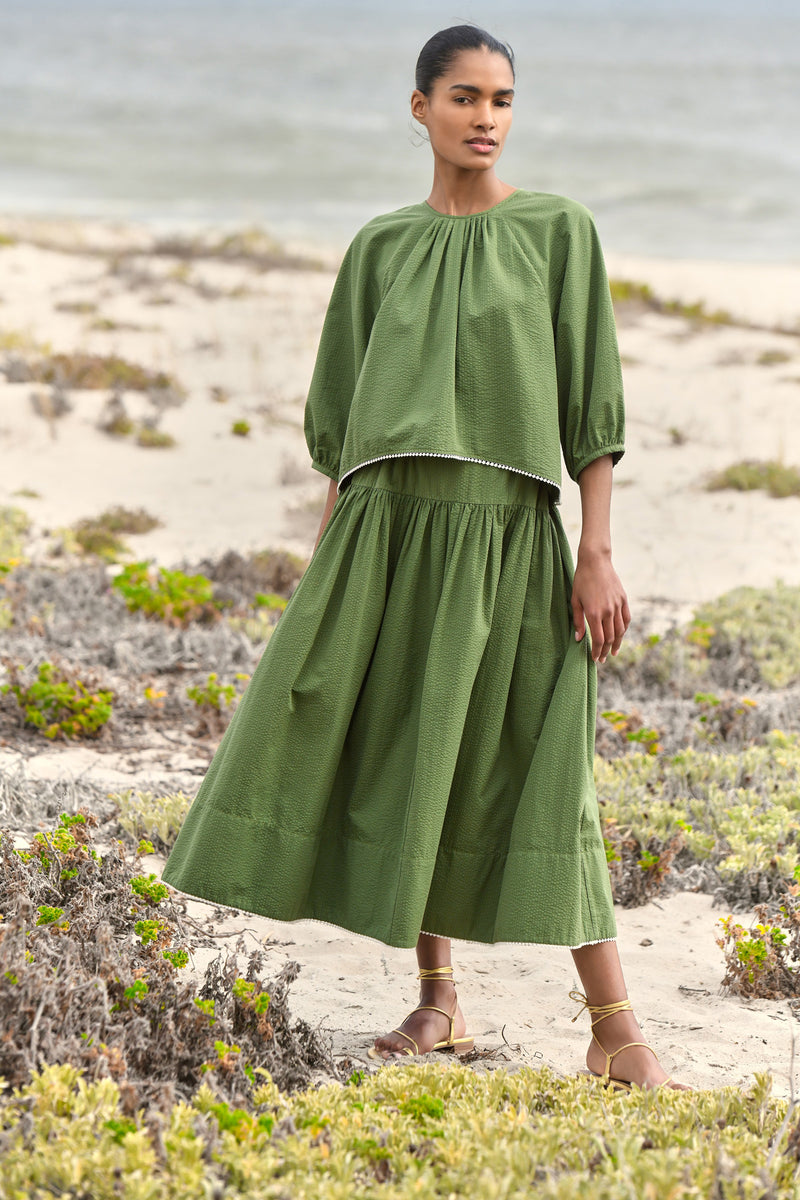 Wiggy Kit | Tie Back Top (Green Seersucker) | Model wearing green blouse and green skirt