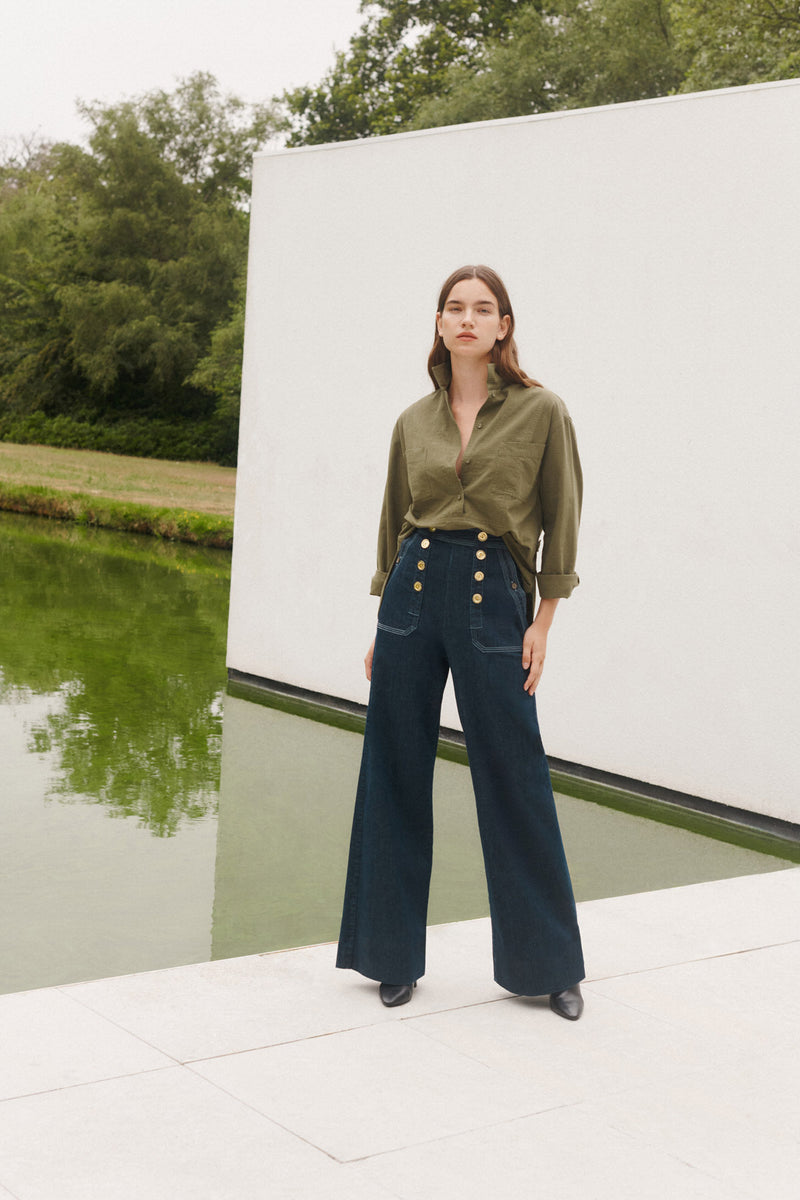Wiggy Kit | The Sailor Jean in Indigo | Model Wearing Jeans and Green Top