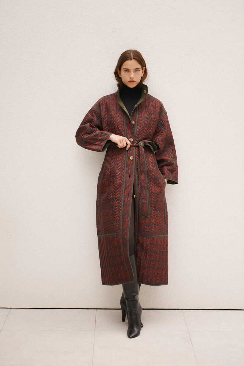 Wiggy Kit | Reversible Quilted Coat | Model Wearing Reversible Quilted Coat in Pink and Black Print