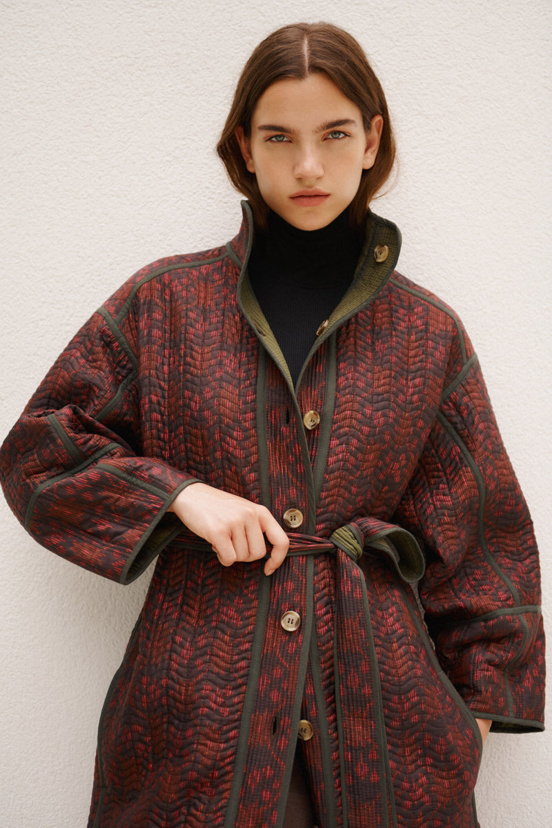 Wiggy Kit | Reversible Quilted Coat | Model Wearing Reversible Quilted Coat in Pink and Black Print