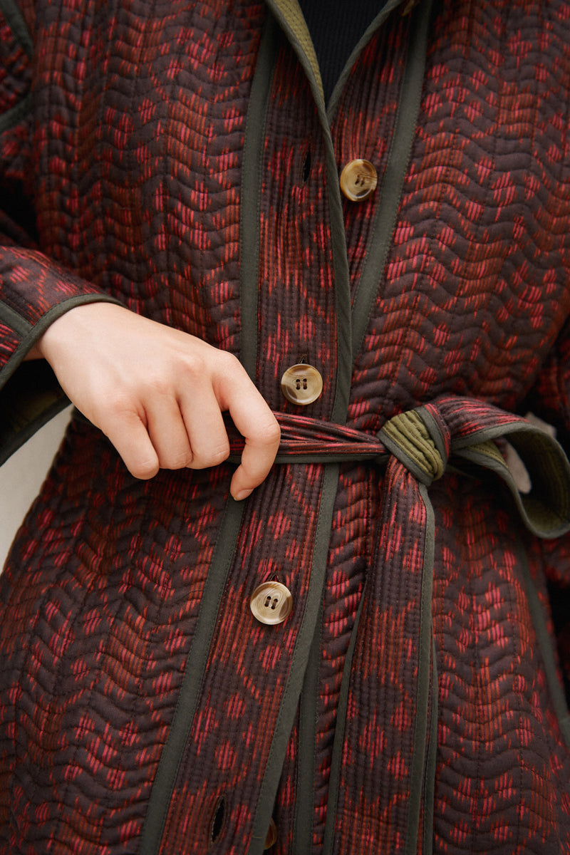 Wiggy Kit | Reversible Quilted Coat | Model Wearing Reversible Quilted Coat in Pink and Black Print