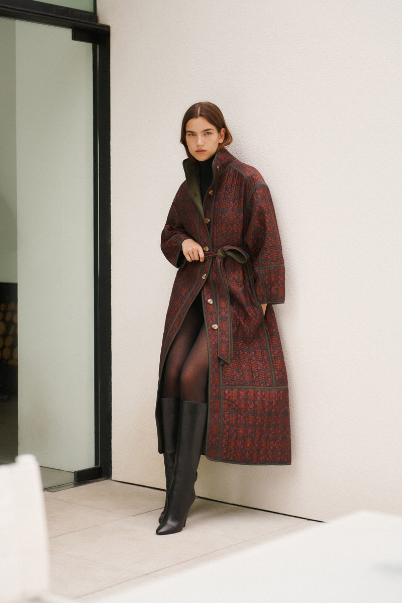 Wiggy Kit | Reversible Quilted Coat | Model Wearing Reversible Quilted Coat in Pink and Black Print
