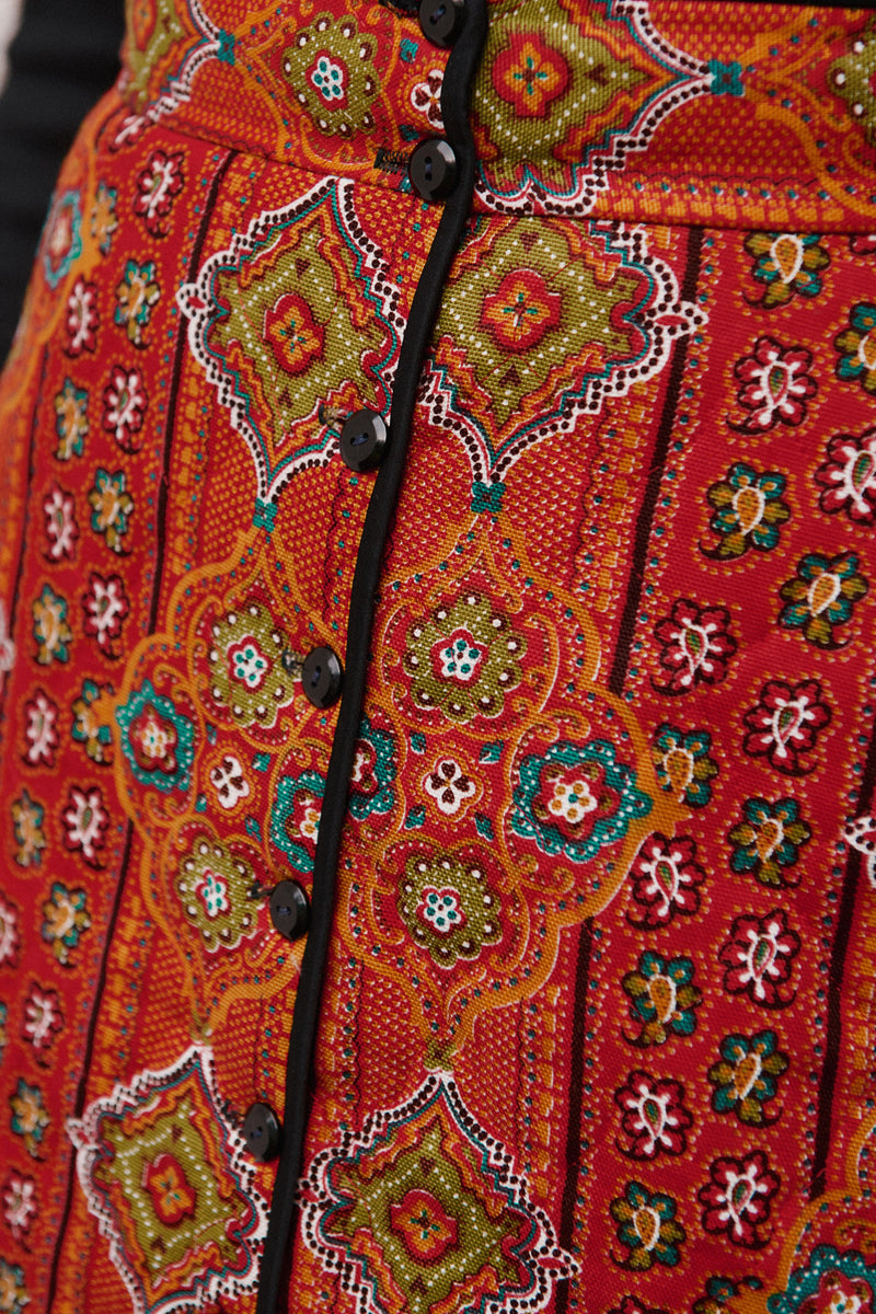 Wiggy Kit | The Quilted Skirt in Orange Multi Print | Model Wearing Orange Print Skirt