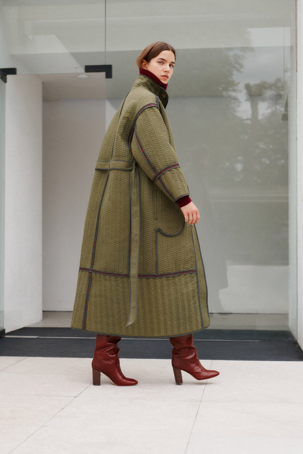 Wiggy Kit | Reversible Quilted Coat | Model Wearing Reversible Quilted Coat in Green Print
