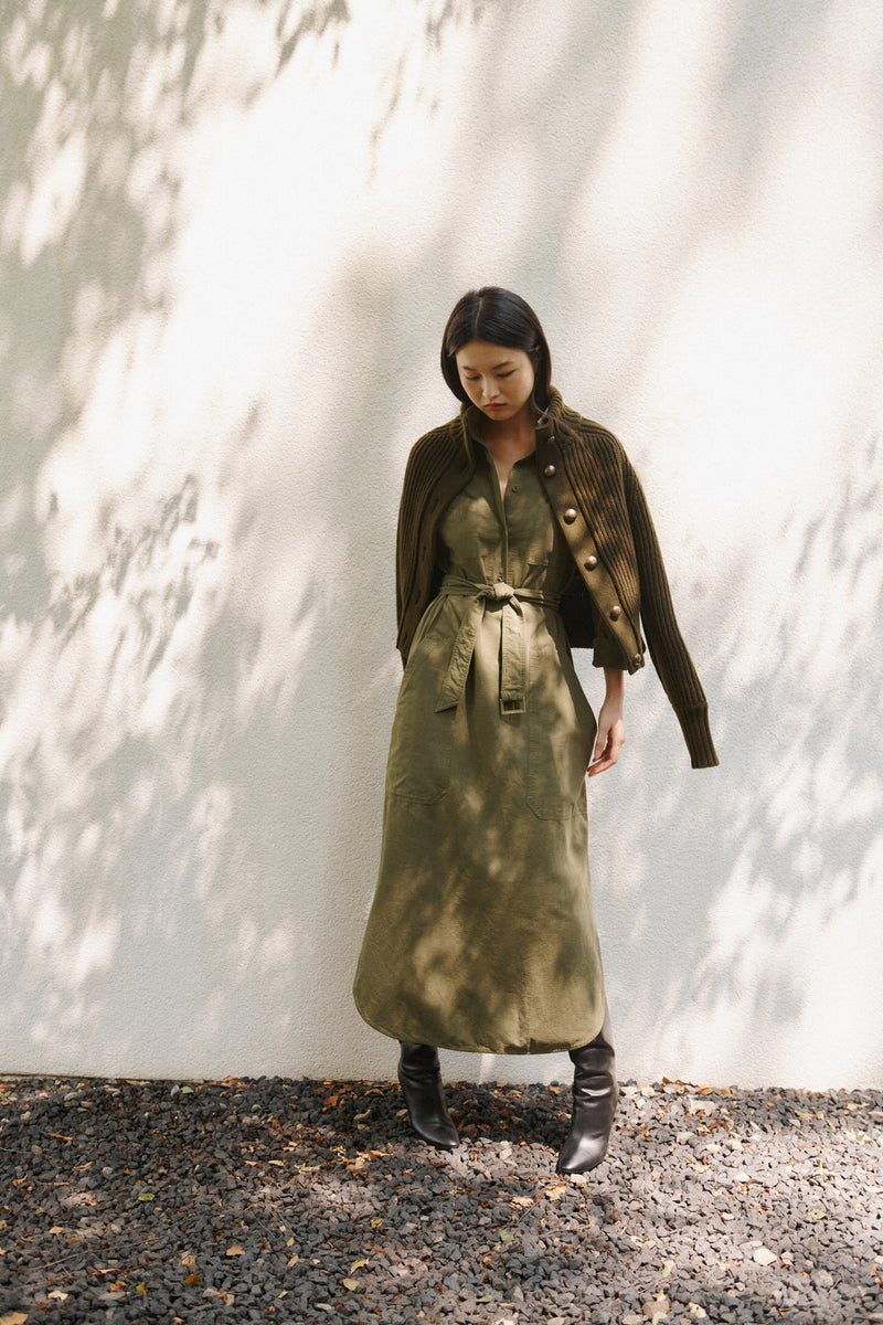 Wiggy Kit | Ribbed High Neck Jacket in Green | Model Wearing Ribbed High Neck Jacket with Green Dress