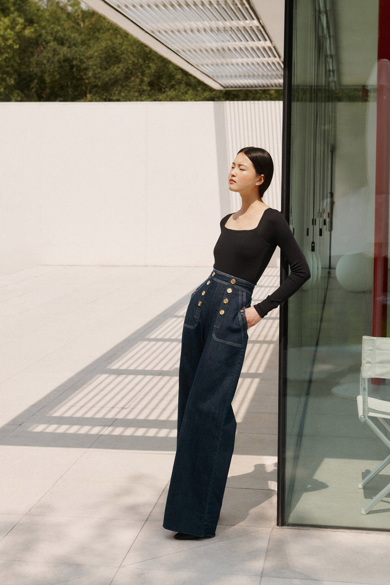 Wiggy Kit | The Sailor Jean in Indigo | Model Wearing Jeans and Black Top