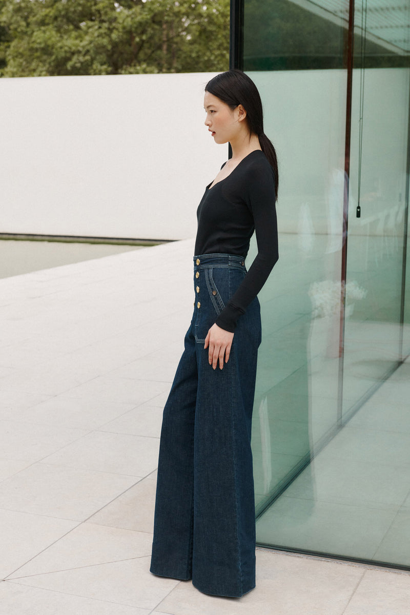 Wiggy Kit | The Sailor Jean in Indigo | Model Wearing Jeans and Black Top