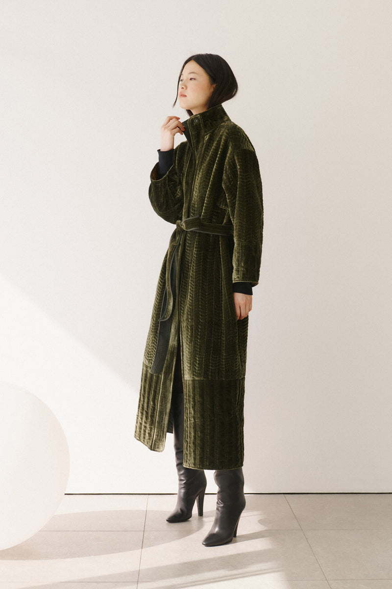 Wiggy Kit | The Velvet Quilted Coat in Dark Green | Model Wearing Long Green Coat