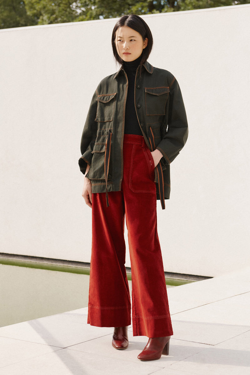Wiggy Kit | The Milano Jacket in Green | Model Wearing Green Jacket with Red Jeans