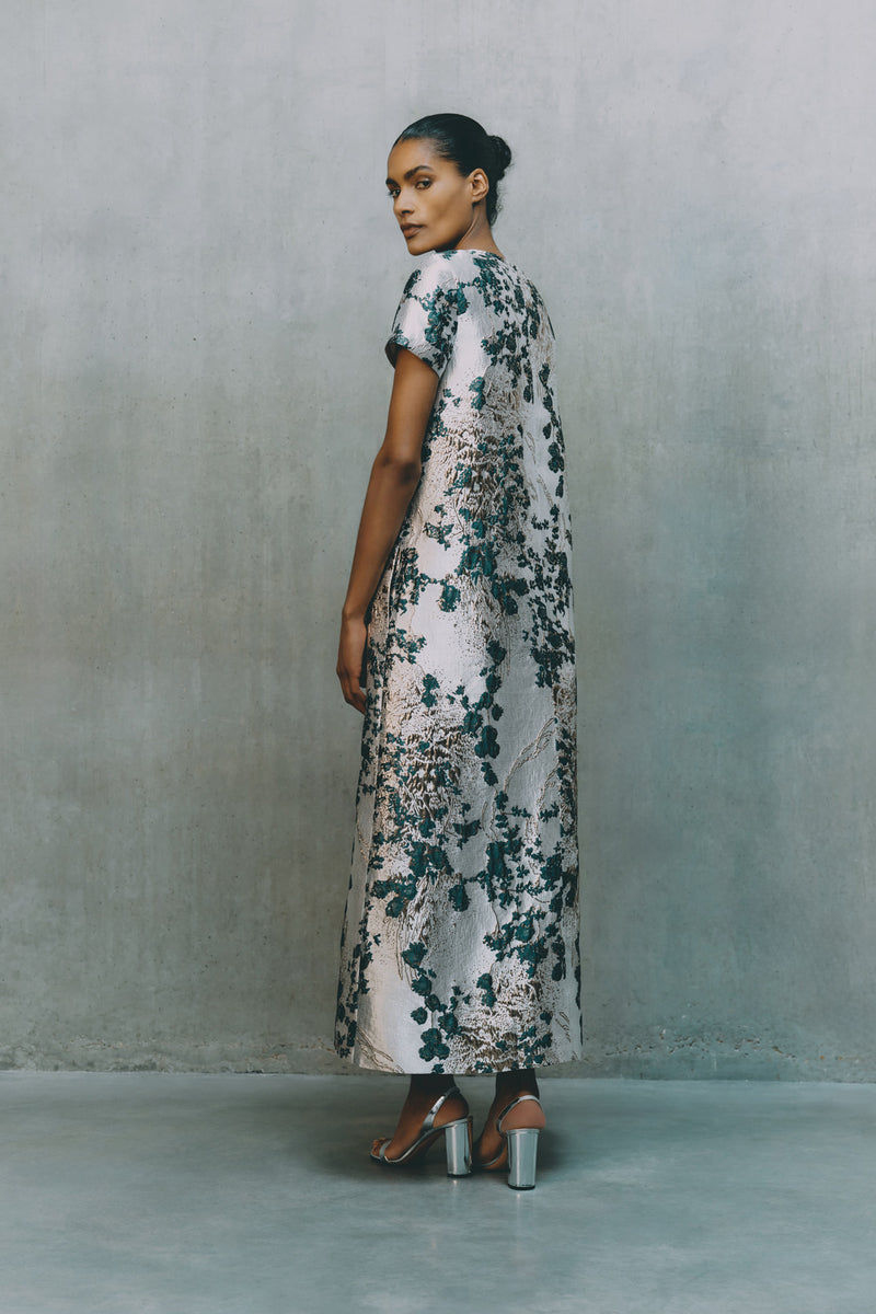 Wiggy Kit | Sputnik Dress | Model Wearing Long Silver Dress with Floral Inspired Detailing