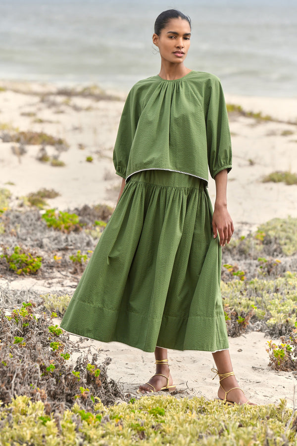 Wiggy Kit | Sicily Skirt | Model wearing green midi skirt with green blouse