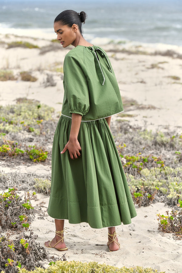 Wiggy Kit | Sicily Skirt | Model wearing green midi skirt with green blouse