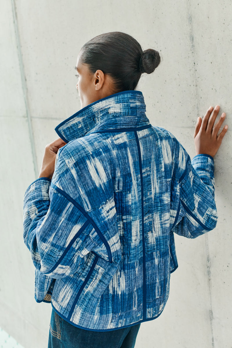 Wiggy Kit | Quilted Double-Breasted Jacket | Model wearing reversible blue and white patterned jacket