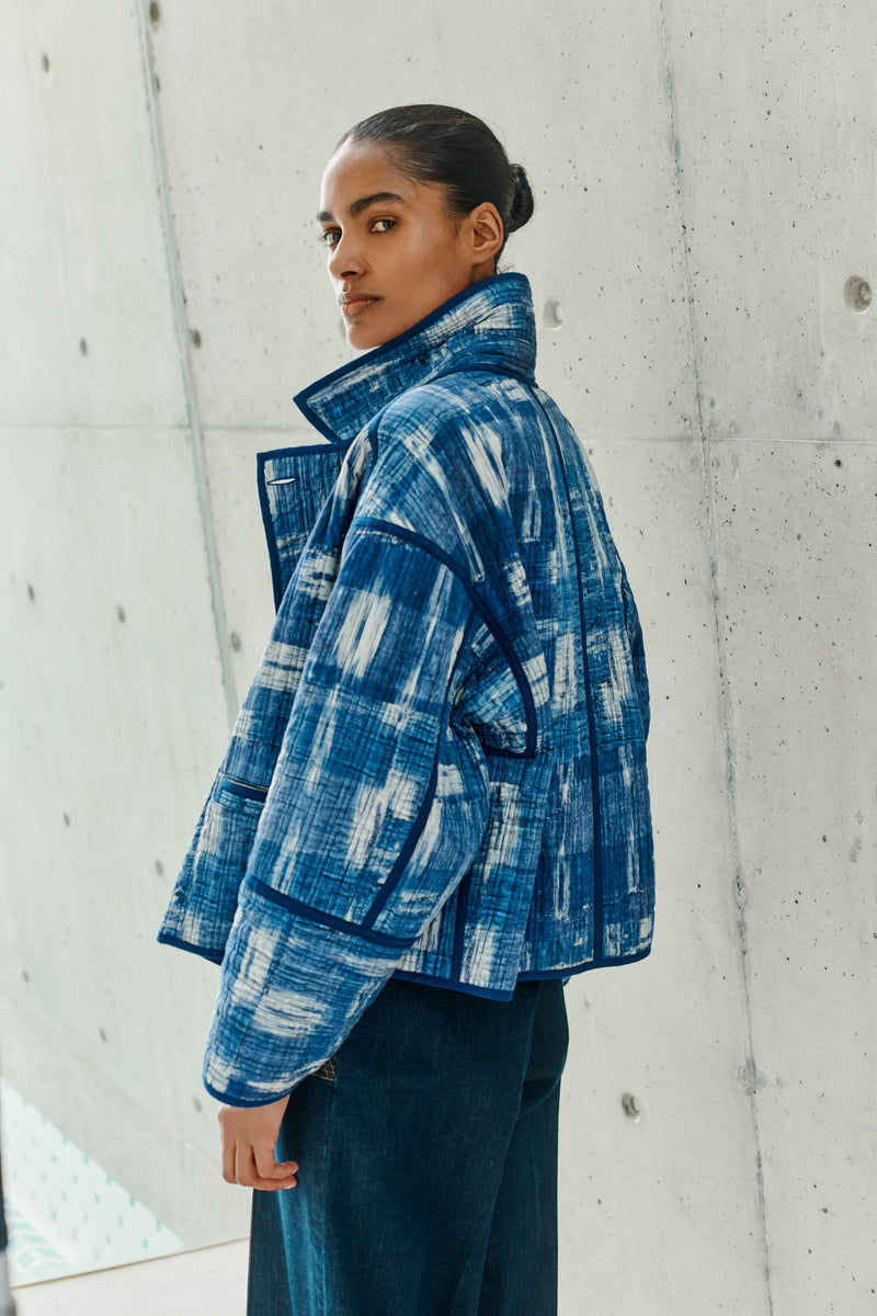 Wiggy Kit | Quilted Double-Breasted Jacket | Model wearing reversible blue and white patterned jacket