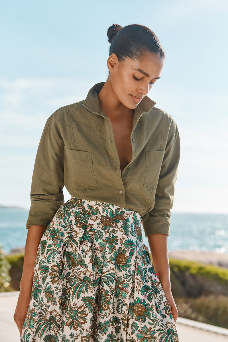 Wiggy Kit | The Friday Skirt | Model wearing jungle print midi skirt with green shirt