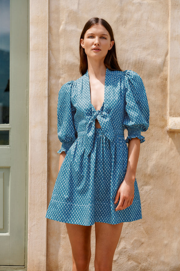 Wiggy Kit | Mini Bunny Dress | Model wearing blue patterned mini dress