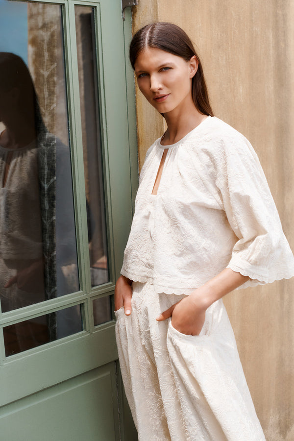 Wiggy Kit | Gaucho Top (Embroidered Cotton) | Model wearing white textured blouse