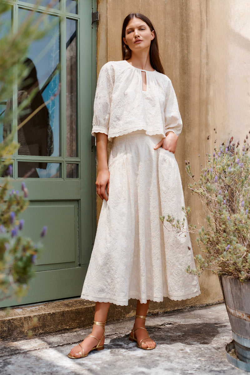 Wiggy Kit | Fable Skirt (Embroidered Cotton) | Model wearing white midi skirt with white blouse