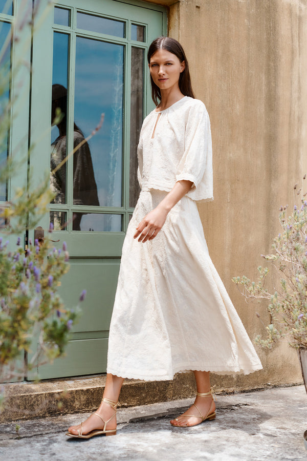 Wiggy Kit | Fable Skirt (Embroidered Cotton) | Model wearing white midi skirt with white blouse