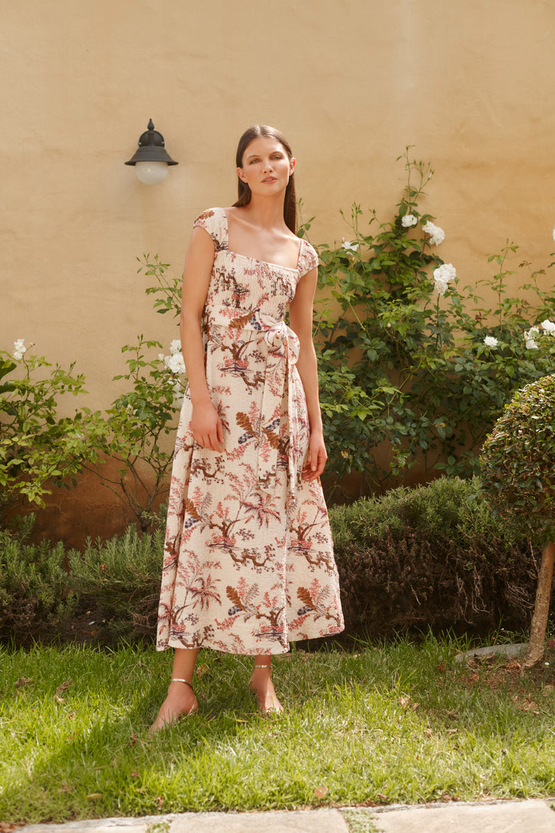 Wiggy Kit | The Clover Dress | Model wearing cream and pink floral print midi dress