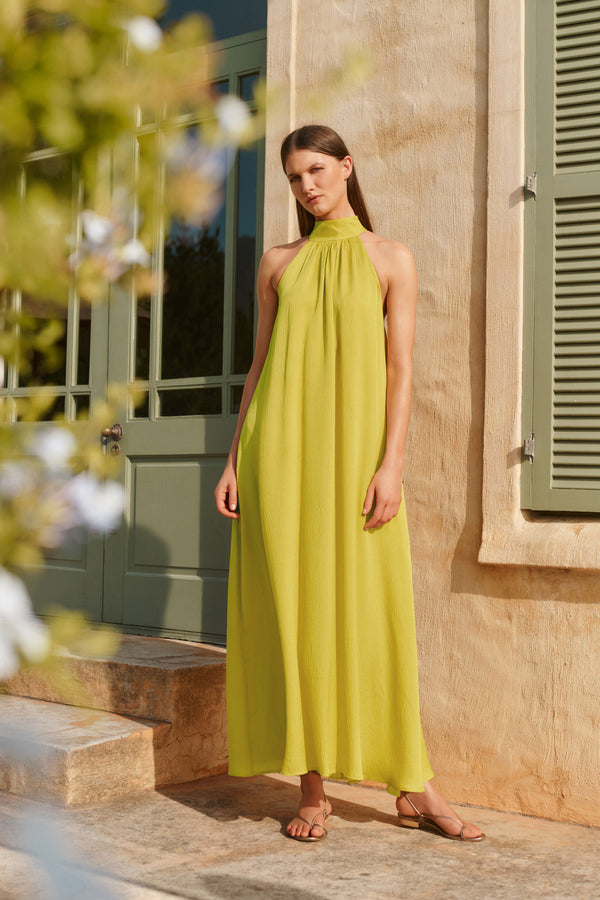 Wiggy Kit | The Aster Dress | Model wearing yellow maxi dress