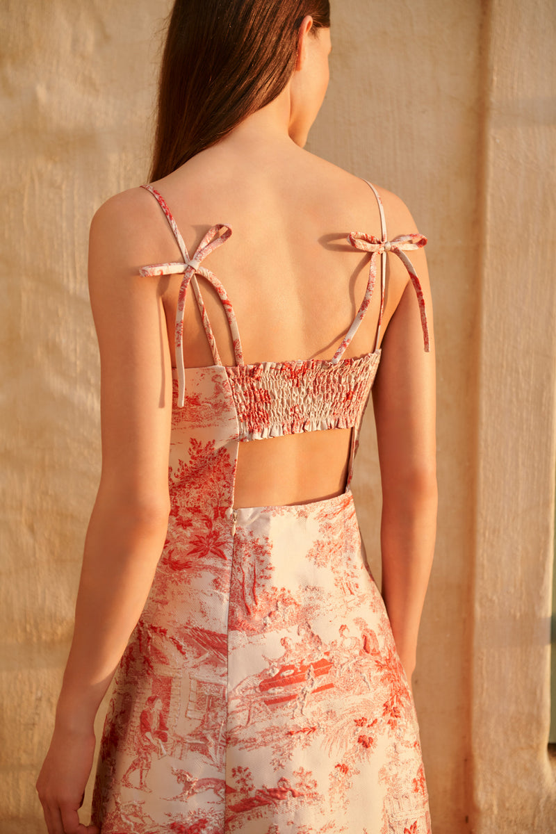 Wiggy Kit | Ekberg Dress (Toile De Jouy) | Model wearing red and cream pattern occasion dress