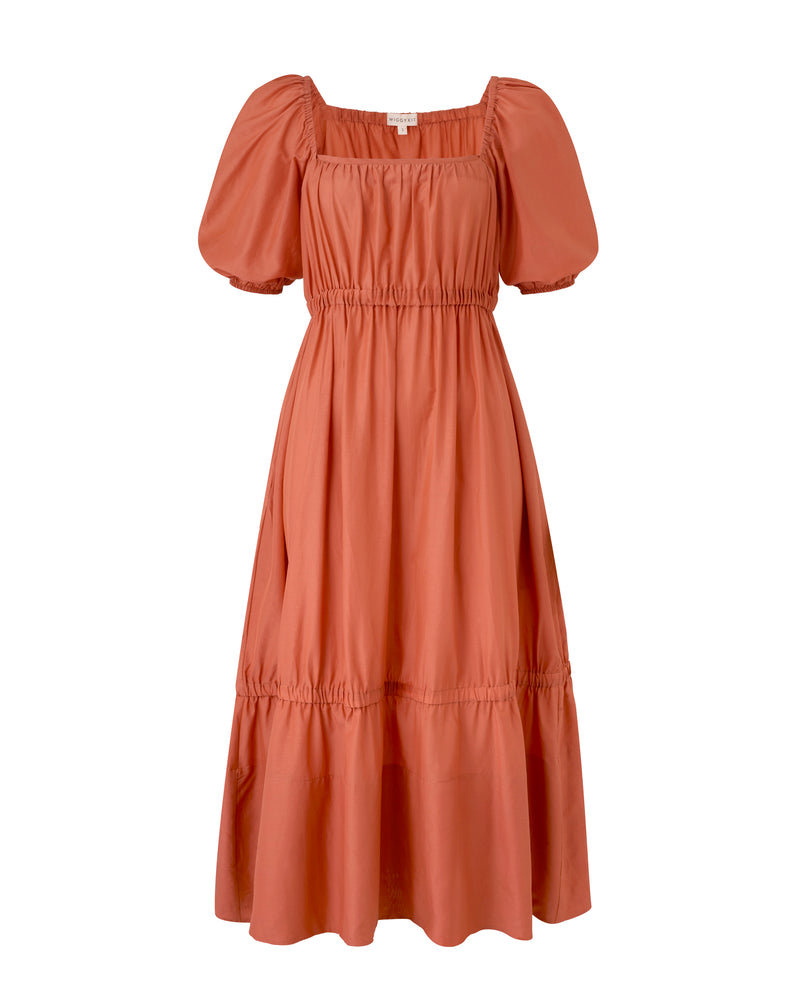 Wiggy Kit | The Toto Dress | Product image of rusty orange midi dress with puffy sleeves