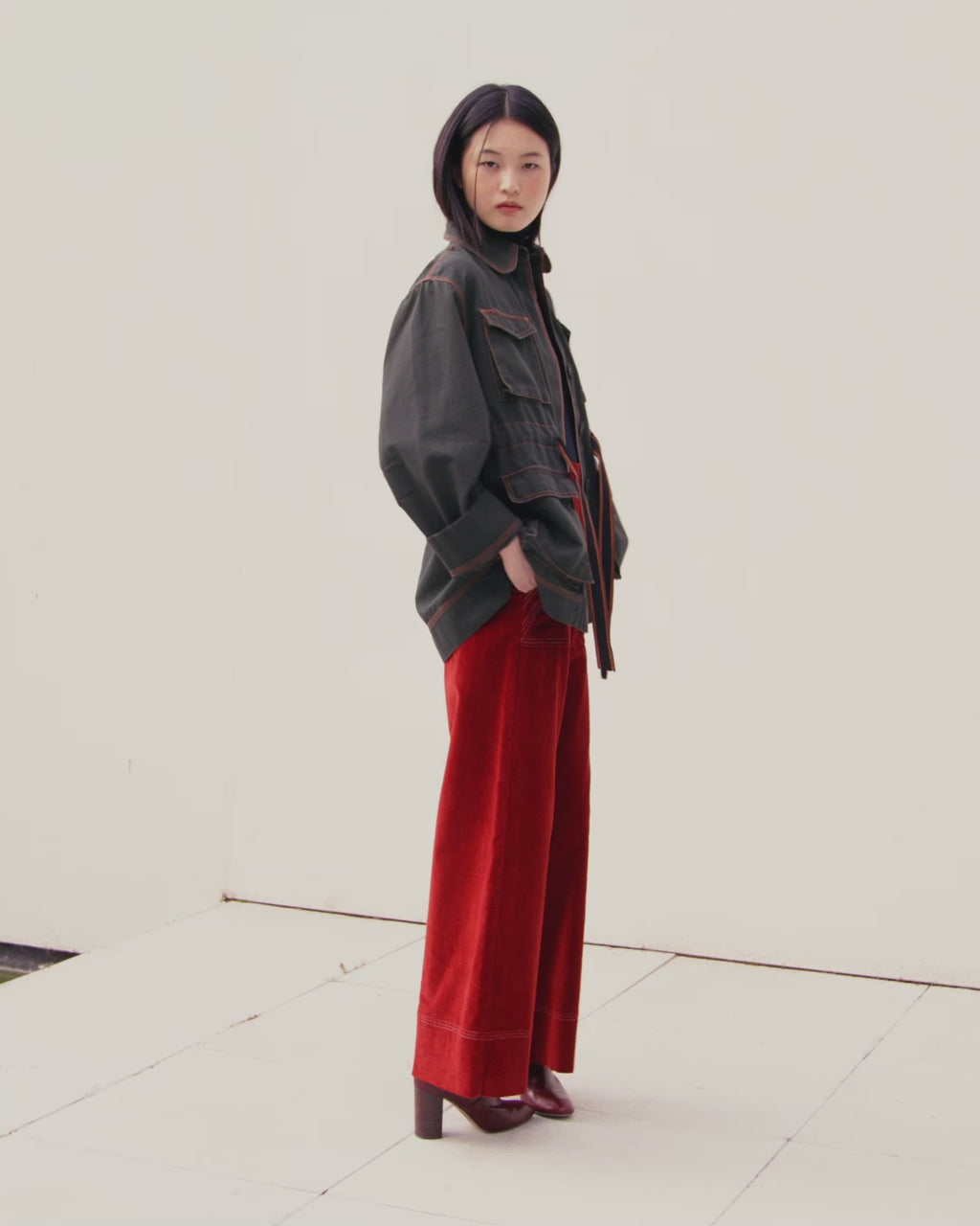 Wiggy Kit | The Milano Jacket in Green | Video of Model Wearing Green Jacket with Red Jeans