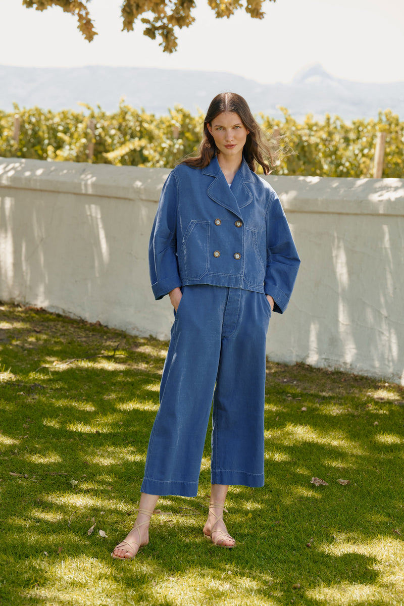 Wiggy Kit | Chore Pants in Blue | Lifestyle Image, Front of Trousers with Jacket