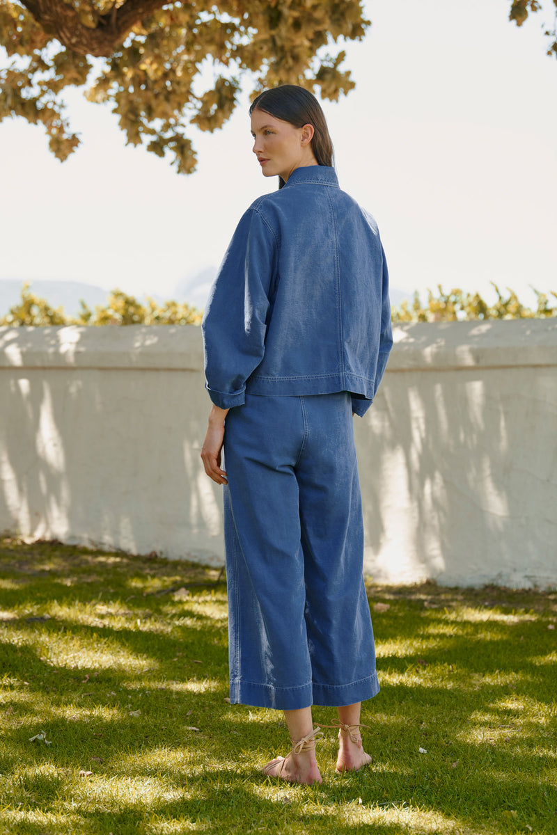 Wiggy Kit | Chore Jacket in Blue | Lifestyle Image, Back of Jacket