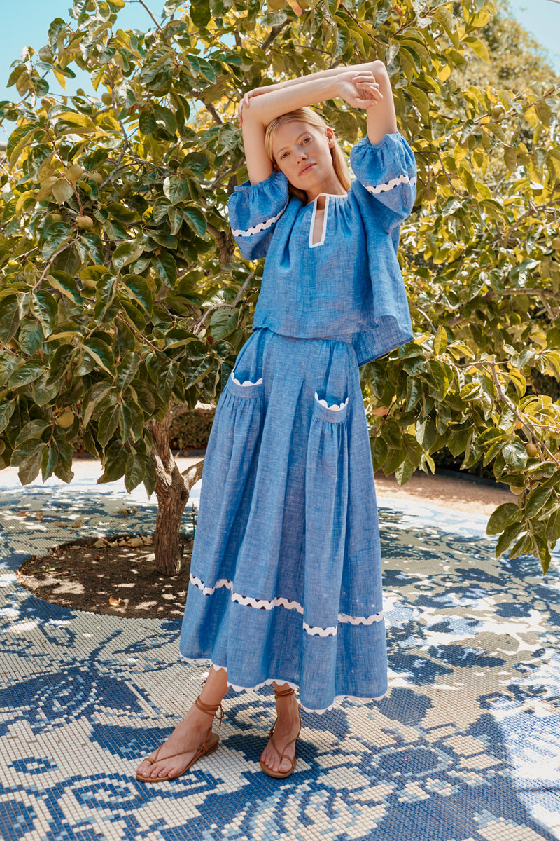 Wiggy Kit | Gaucho Top in Blue Linen | Lifestyle Image, Front of Top with Model by Tree
