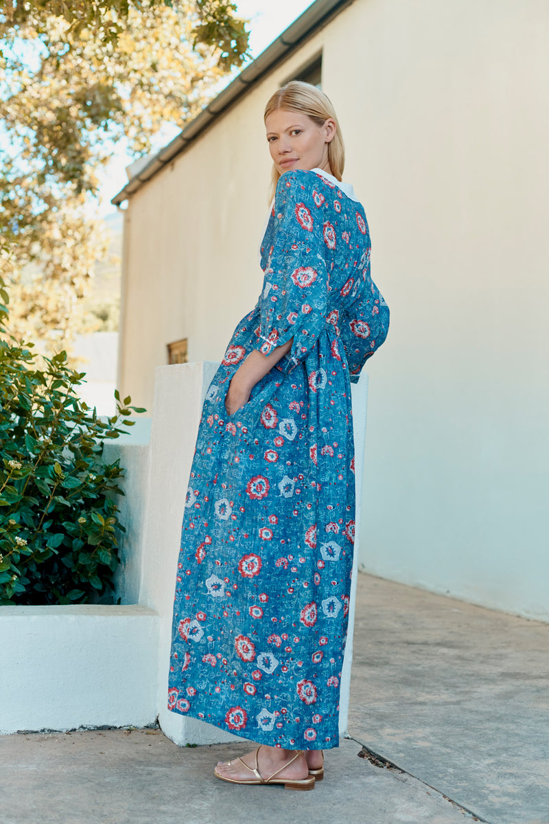 Wiggy Kit | Market Dress in Blue Floral Print | Lifestyle Image, Back of Dress